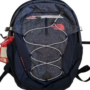 navy blue and pink north face backpack